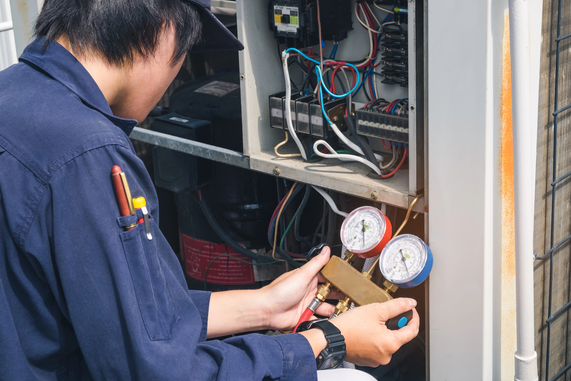 A technician inspecting a furnace