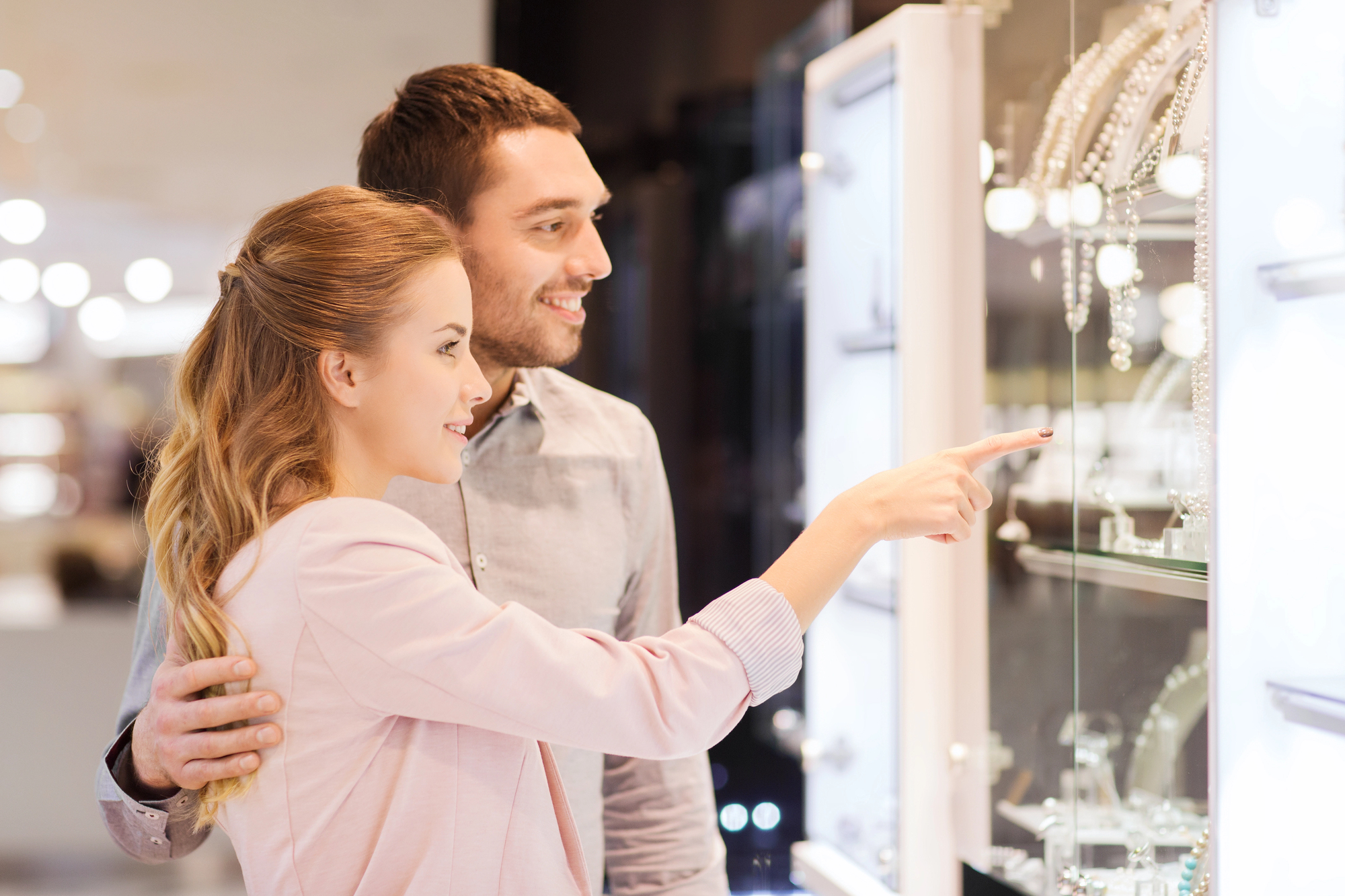 A couple deciding which Jewelry to buy