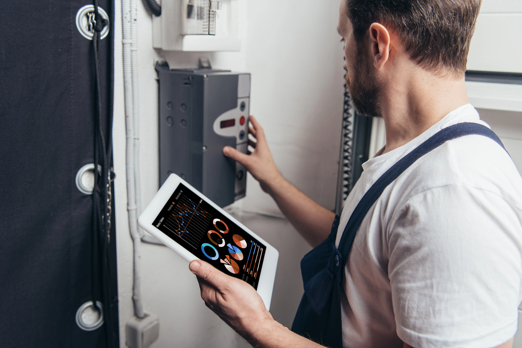 Electrician checking panels
