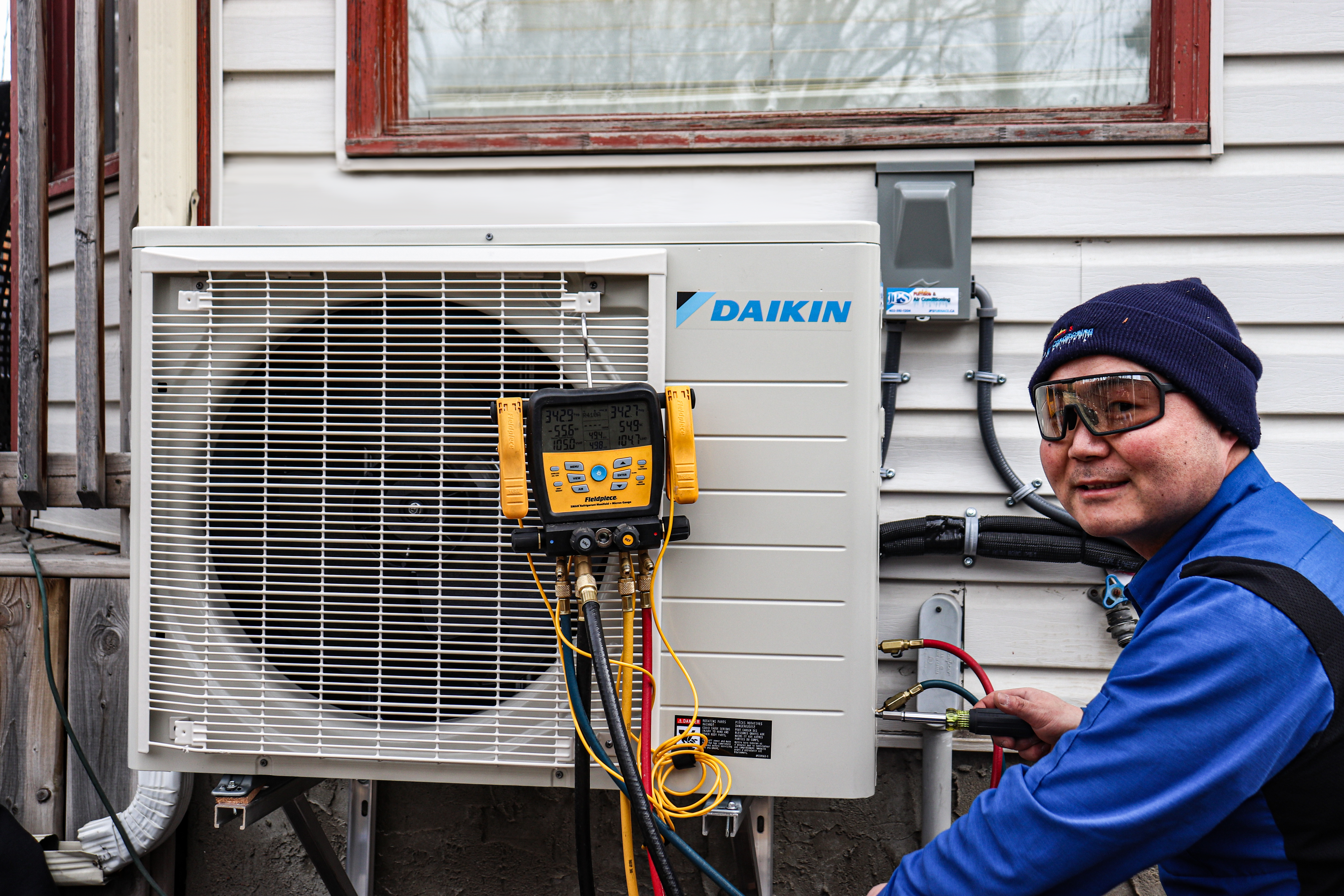 JPS Service technician performing an AC tune up
